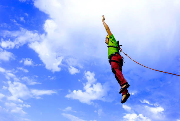 istock Jump rope from a high rock in the mountains. 646362964