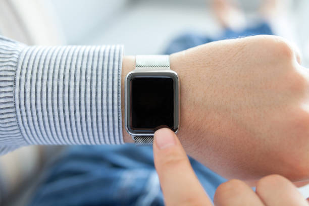 istock Man hands with smart watch and finger touching 646363008