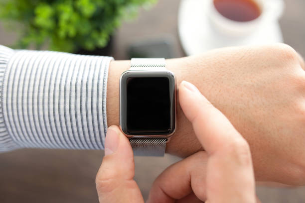 istock Man hands with smart watch in the office 646363116