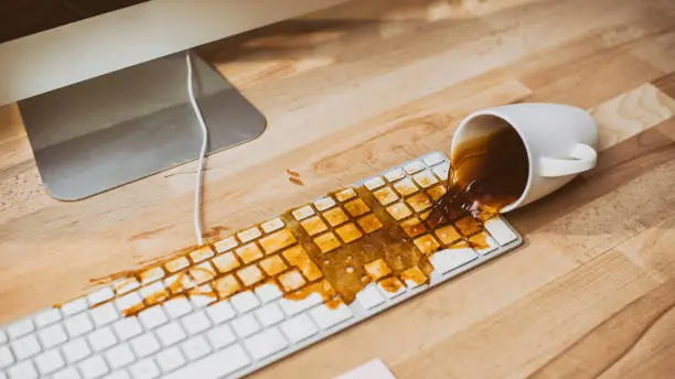 Coffee spilled on computer keyboard.