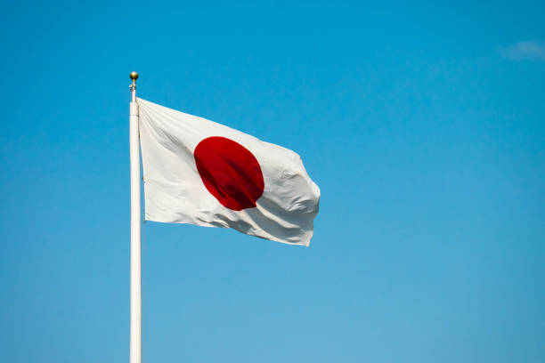 istock Japanese flag on blue sky background 646367502