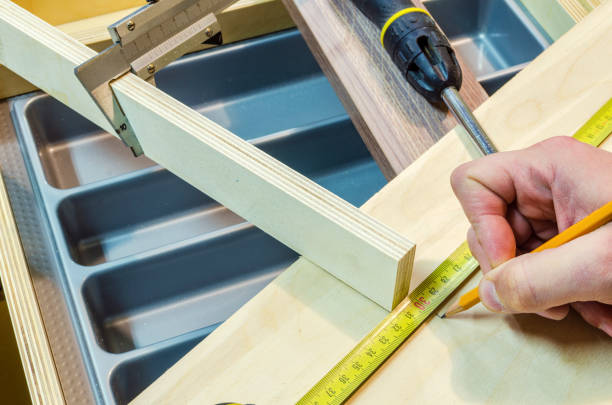istock Assembling of furniture for kitchen 646370164
