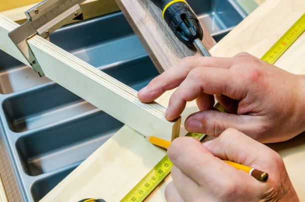 istock Assembling of furniture for kitchen 646370202