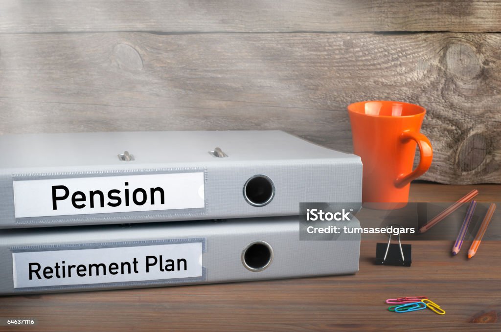 Retirement Plan and Pension - two folders on wooden office desk Retirement Plan and Pension - two folders on wooden office desk. Pension Stock Photo