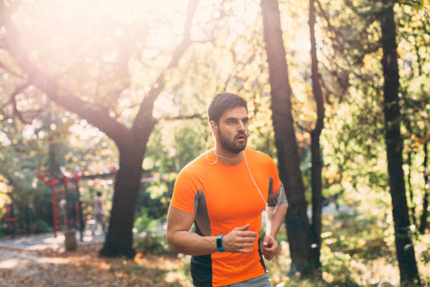 istock Man jogging in the park 646381266