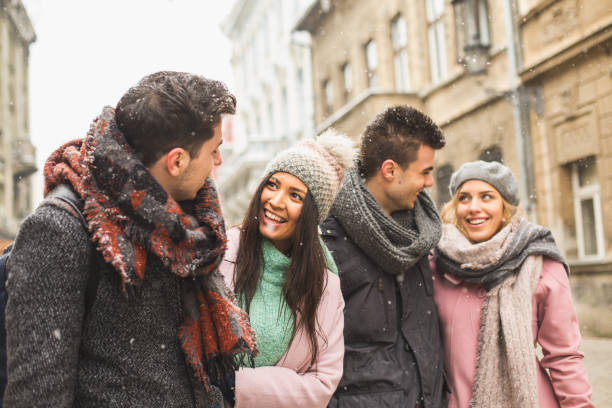 istock Friends walking together on city streets 646385112