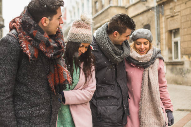 istock Friends walking together on city streets 646385116