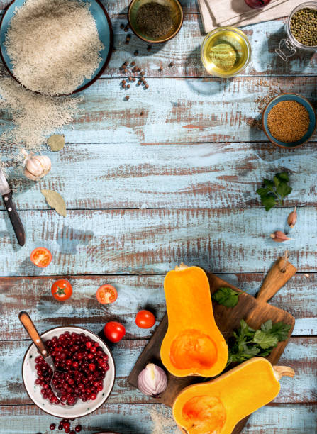 istock Ingredients for cooking baked squash on blue wooden table 646390204