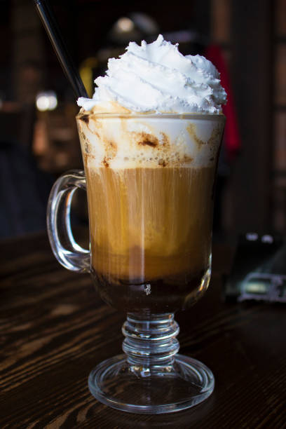 istock Coffee cappuccino in a glass cup on wooden table 646390624
