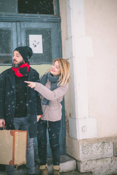 istock Young old-fashioned couple waiting for the train. 646396634