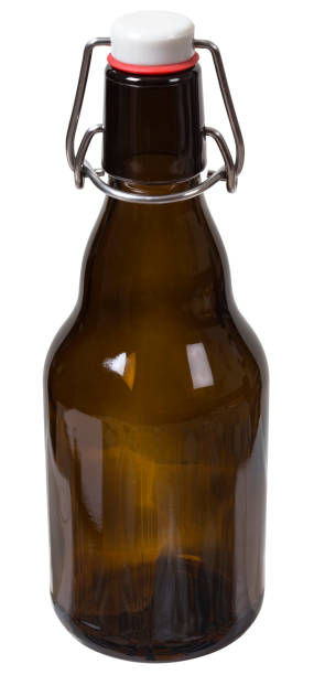 istock Empty glass bottle with the closed cap hold isolated 646397424