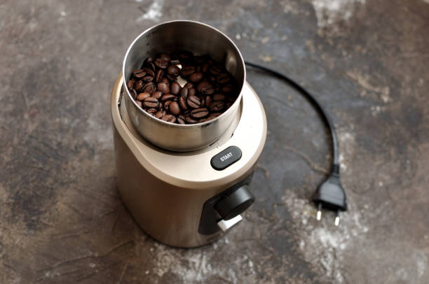 istock Electric coffee grinder with roasted coffee beans 646397456