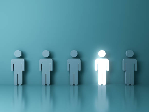 istock Stand out from the crowd and different creative idea concepts , One glowing light man standing among green people on green background 646417826