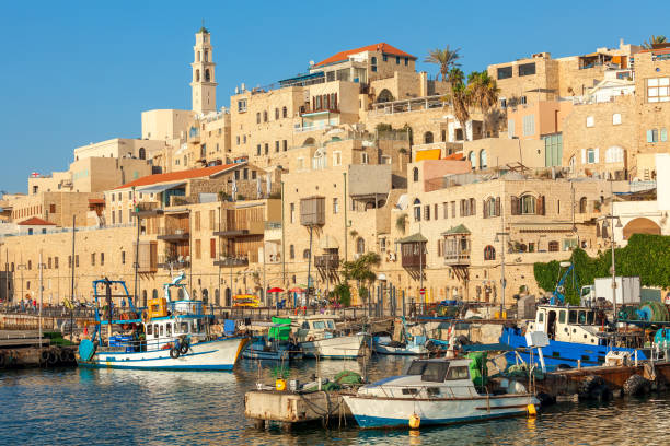 View of old Jaffa in Israel. Boats on small harbor and old houses in Jaffa, Israel. jaffa stock pictures, royalty-free photos & images