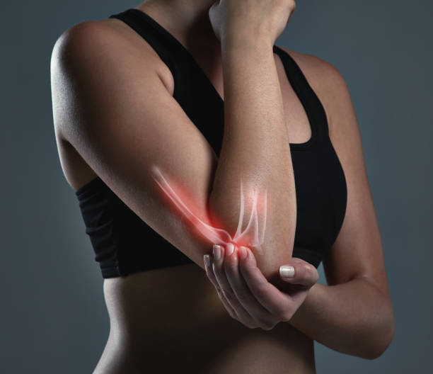 Follow the simple steps to prevent injuries during your workout Studio shot of a sporty young woman elbow photos stock pictures, royalty-free photos & images
