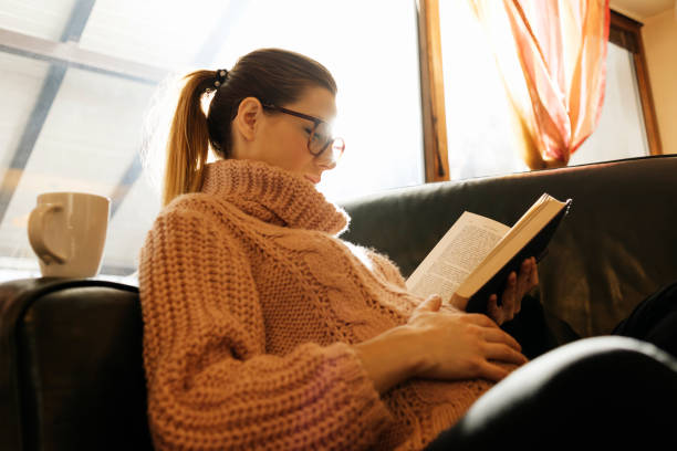 istock pregnant woman reading a book 646430864