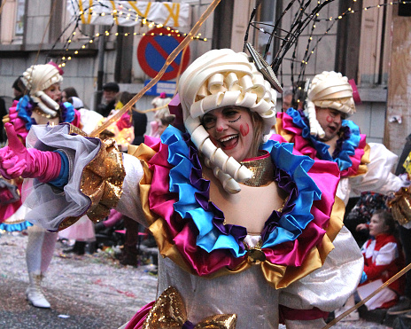 Aalst, Belgium- February 26, 2017: Unknown female dancer enjoying the parade during the annual carnival in Aalst, which is a UNESCO recognized event of Intangible Cultural Heritage.