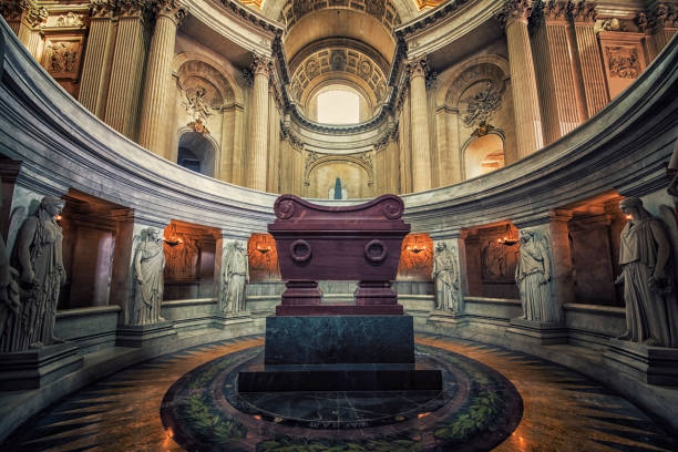 Paris France June 11 2025: The Tomb of Napoleon lies beneath the dome of the Dôme des Invalides, one of the most recognizable landmarks in Paris, and is a place of deep symbolism and imperial grandeur. The sarcophagus sits at the center of a circular crypt, below the dome, accessible to visitors peering down from above. The design intentionally requires viewers to bow their heads to look down upon the tomb — symbolically a gesture of respect to the Emperor.circular