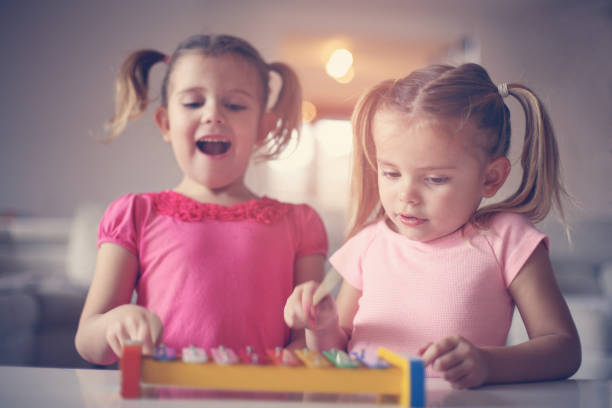 istock Two little girl at music school. 646437152