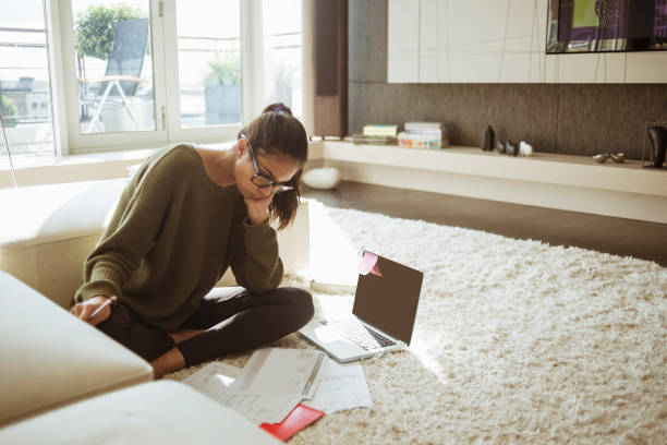 istock young woman studying in her living room 646439328