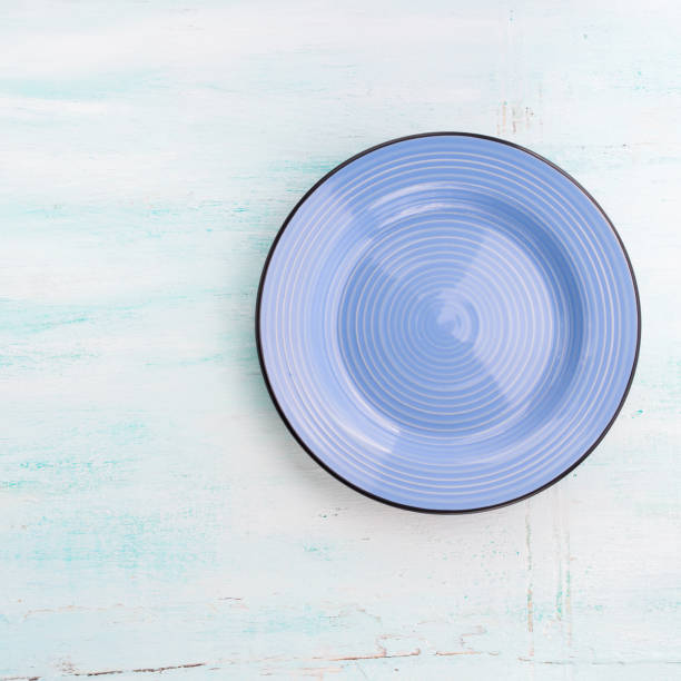 istock Pastel Color ceramic plate dish top view background 646453084