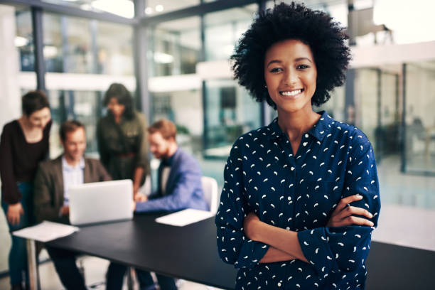 meeting status? 100% productive - business women manager looking at camera imagens e fotografias de stock