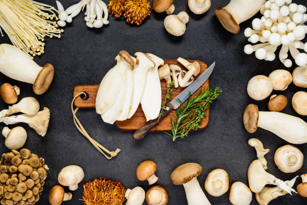 istock Edible Mushrooms with Chopping Board 646480026