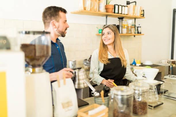 istock Baristas working together in a coffee shop 646487508