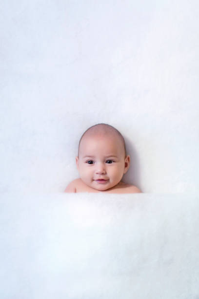 istock cute baby smiling over white background 646491512