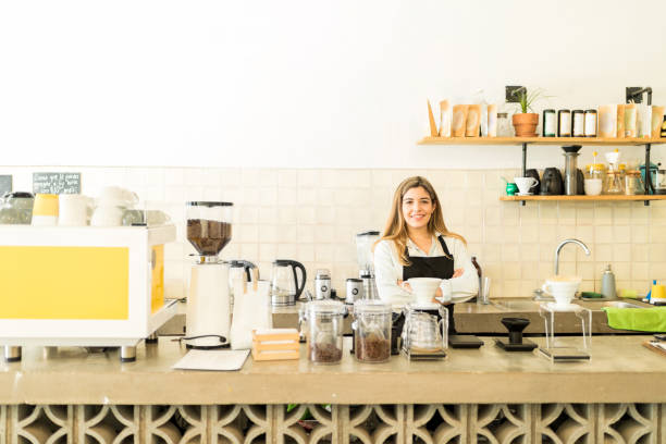 istock Beautiful barista in a coffee shop 646492376