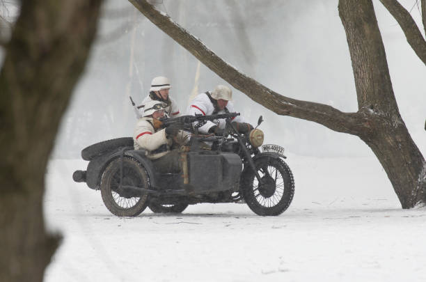 German motorcyclists armed with a machine gun MG42 The park Ekaterinhof, St. Petersburg (Russia) - February 23, 2017: Military historical reconstruction of events of World War II. mg42 stock pictures, royalty-free photos & images
