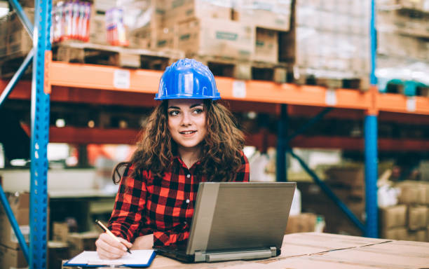 istock Businesswoman at warehouse checking inventory 646495084