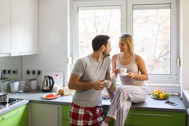 istock Romantic couple enjoying coffee and romance on weekend morning. 646504328