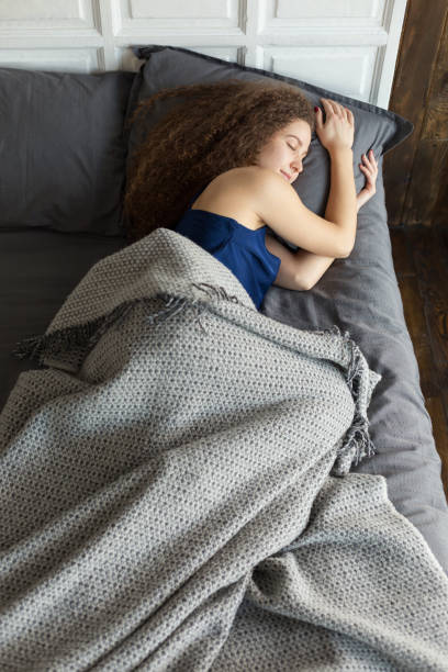 istock Young girl sleeping in the bed 646511498
