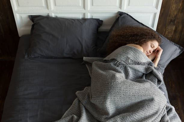 istock Young girl sleeping in the bed 646512230