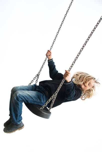 istock Little child blond girl having fun on a swing 646514862