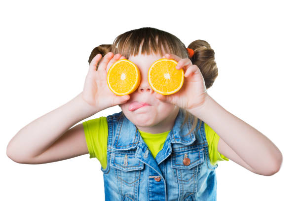istock Baby a smile and orange on white background 646537570