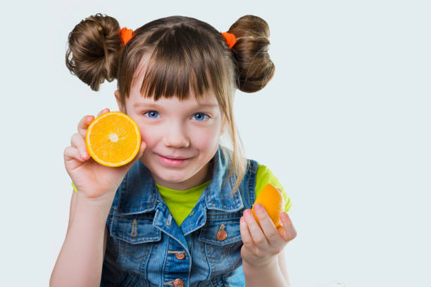 istock Baby a smile and orange on white background 646538536