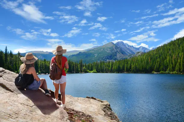 Photo of Friends relaxing on summer vacation in the mountains.