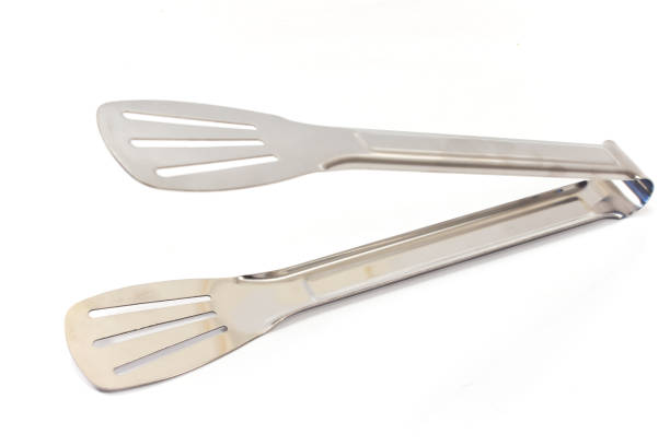 istock Serving kitchen tongs isolated on  white 646554362