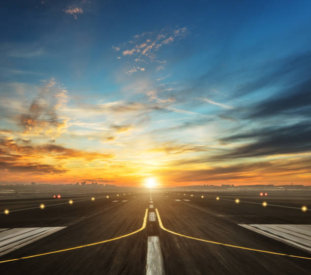 airport runway in the evening sunset light airport runway in the evening sunset light, ready for airplane landing or taking off runway stock pictures, royalty-free photos & images