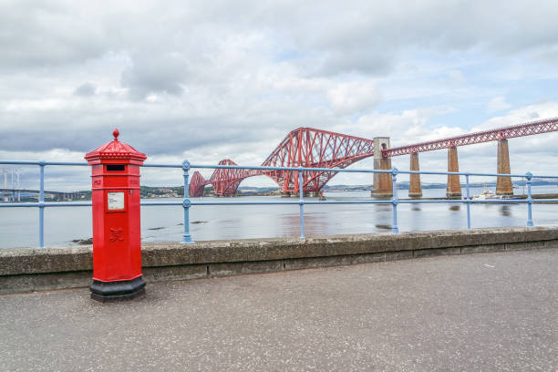 istock Red letterbox and Firth of Forth rail bridge 646560176