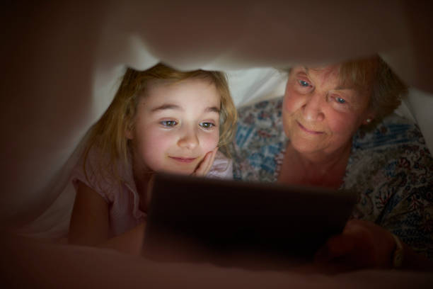 istock bedtime duvet stories with gran 646580400
