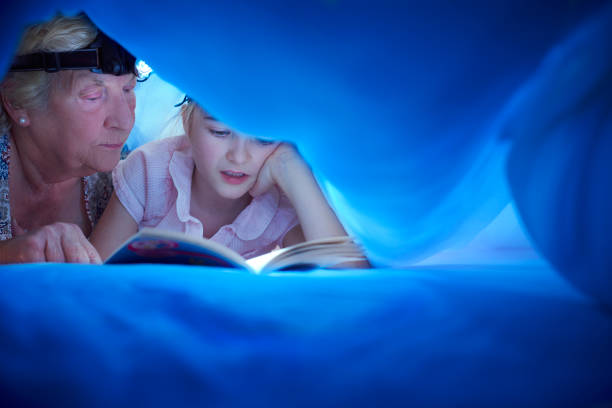 istock gran with a headtorch bedtime story 646581770