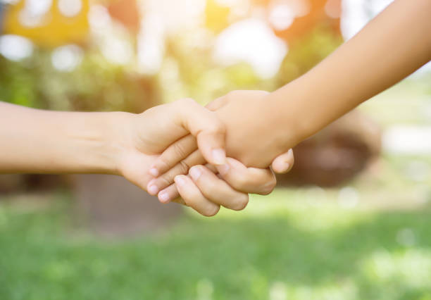 istock Happy couple holding hands in the sunset 646588602