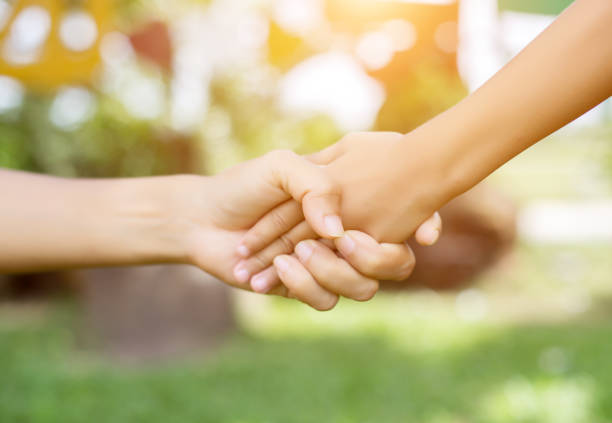 istock Happy couple holding hands in the sunset 646588616