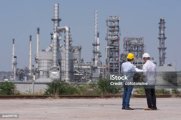 Mechanical Engineering Working In Oil Refinery Stock Photo - Download Image Now - Planning, Industry, Construction Site