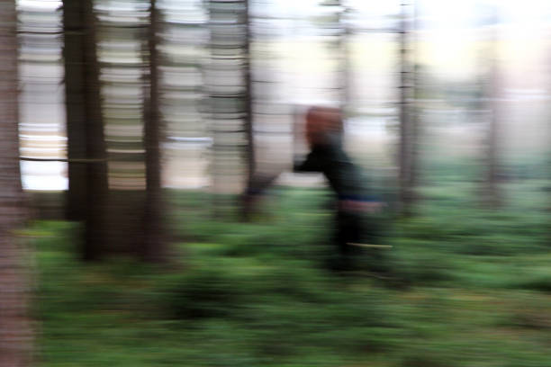 Blurred picture - A woman in the forest