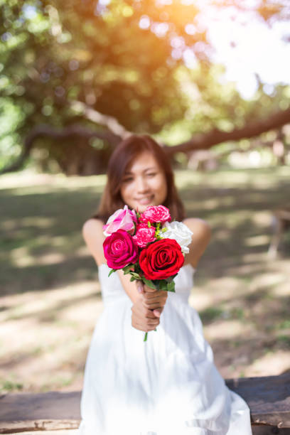 istock Flowers in woman hand 646597690