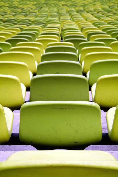 istock Green sport stadium seats 646607756